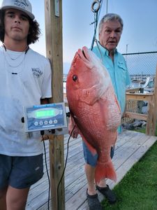 2 people fishing in Gulf Shores