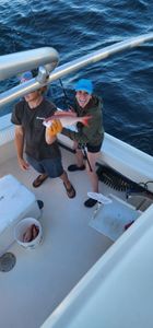 Two people fishing in the waters of Gulf Shores