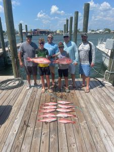 Group of people enjoying fishing in Gulf Shores