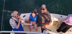Fishing expedition on boat in Gulf Shores AL waters with fishing rod and gear