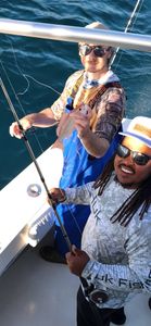 Fishing charter in Gulf Shores AL with caught fish on boat deck