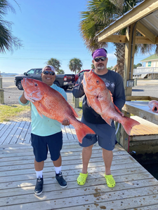 Two anglers with their catch on Dauphin Island