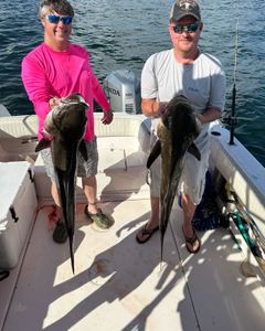 Two people fishing on Dauphin Island