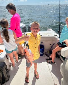 Happy anglers with a caught fish in AL