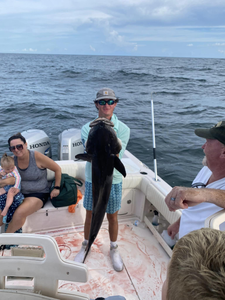 4 people fishing with a big 41-inch catch at Dauphin Island