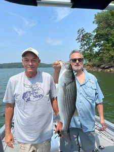 Striped bass caught by two people in Oakwood