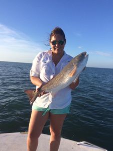 Fisherman holding a 19-inch catch in TX