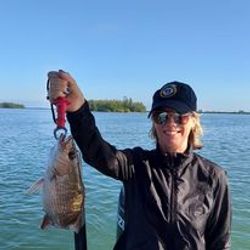 Angler with one small fish caught in Vero Beach