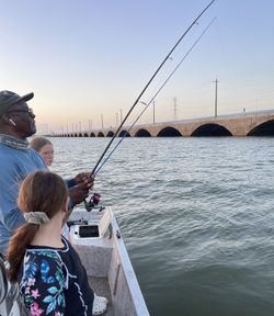 A person fishing in Galveston