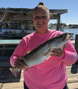 Angler holding a 14-inch fish in Galveston