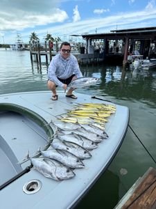 Two anglers catch blackfin tuna and atlantic bonito fish in Islamorada