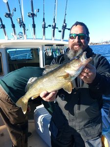 A fisherman holding a 17-inch catch in Henderson