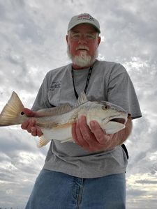 Angler holding a 19-inch fish in NC