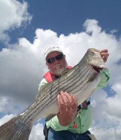 Angler holding a 25-inch fish at North Topsail Beach