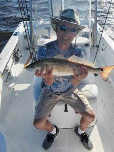 A single angler fishing at North Topsail Beach