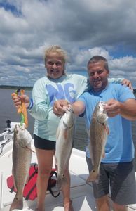 Three huge redfish caught at North Topsail Beach while fishing