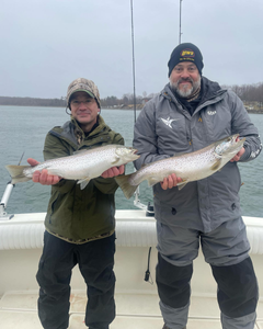 Two anglers fishing for sea trout and rainbow trout in NY
