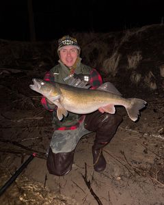 Angler holding a large Pike-Perch in Crandon