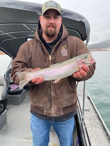 Angler with a beautiful rainbow trout caught in CA