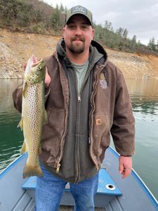 Angler fishing in California with a 22-inch fish