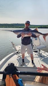 Angler holding a 34-inch fish in Wagoner