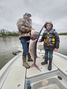 Anglers catching a big fish in Oklahoma