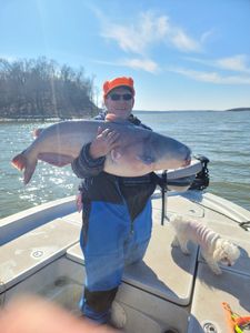 Two anglers holding a large fish in Wagoner