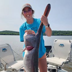 A fisherman holding a 22-inch catch in Wagoner