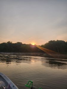 Fisherman casting line in OK location during fishing trip