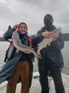 Two people fishing in the OK location