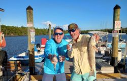 A fisherman holding a redfish in Florida