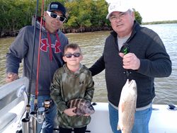 Two redfish and sheepshead caught on a fishing trip in FL
