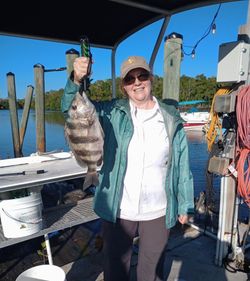 A person fishing for a sheepshead in Florida