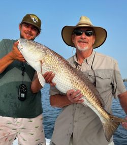 Two anglers with a large 22-inch fish in Jacksonville