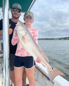 Two people fishing on the beach in Florida