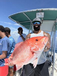 Reeling in the best with a Red Snapper on light tackle in clear waters!