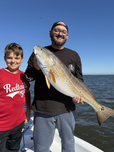 Nice redfish on light tackle! Clearing skies made for an exciting adventure.