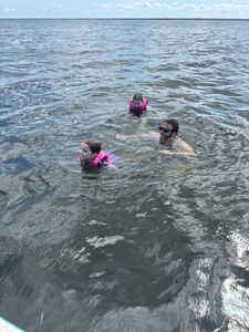 Three people enjoying a fishing tour in Steinhatchee