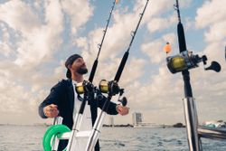 A fisherman standing in Palm Beach Gardens