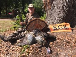 A hunter posing with a large fish caught in Williston