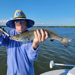 Angler with fishing rod at New Smyrna Beach