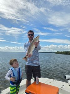 Two people fishing at New Smyrna Beach