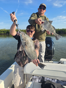 Reeling 'em in by the lake.
