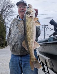 Angler holding a large 43-inch fish in Sturgeon Bay