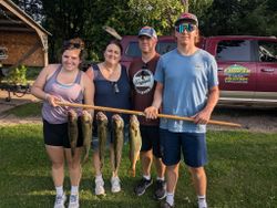 4 anglers holding fishing rods in Wisconsin
