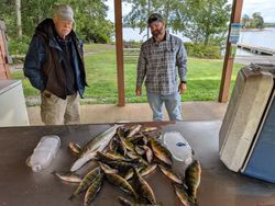 Two anglers fishing in Wisconsin with three fish caught