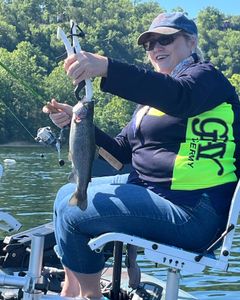 A happy angler with a beautiful rainbow trout caught in MO.
