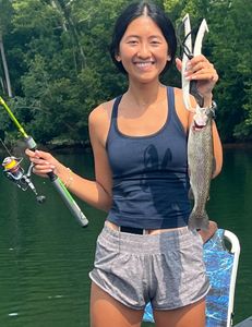 A fisherman caught a beautiful rainbow trout in Missouri
