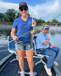 Angler holding a rainbow trout in Kimberling City