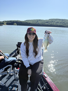 Hooked a tasty white crappie while working the deep waters with some clever jigging and baitcasting techniques!